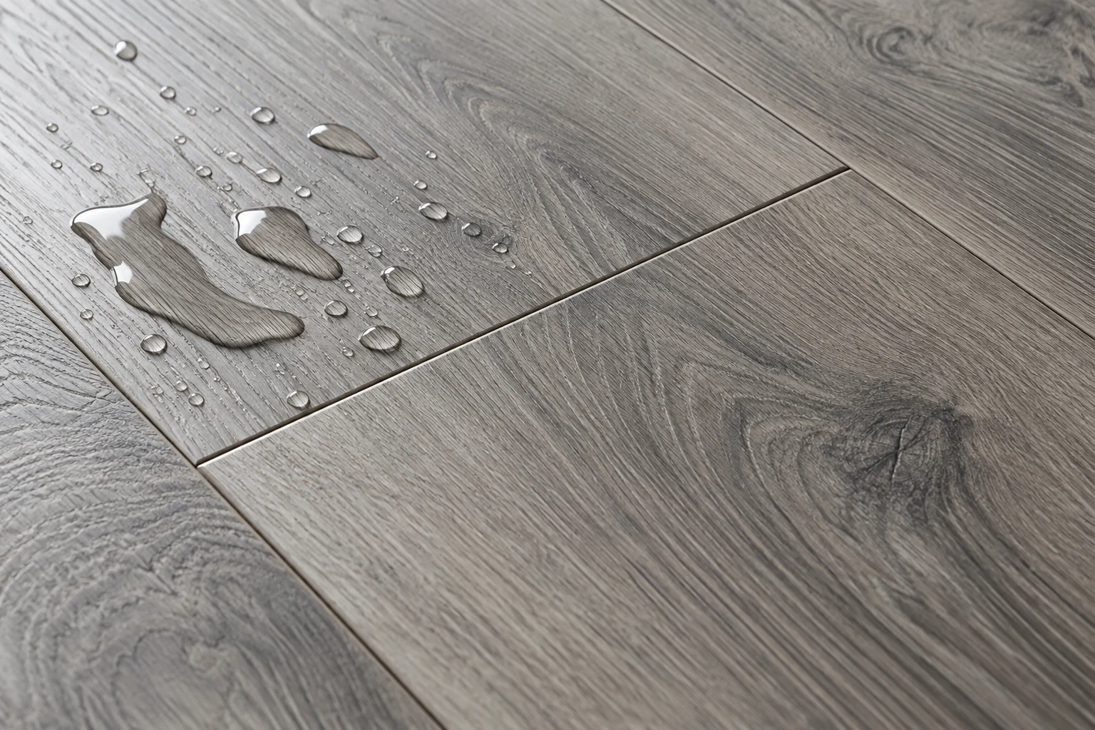 Illustrative grey wood-look laminate surface with water droplets